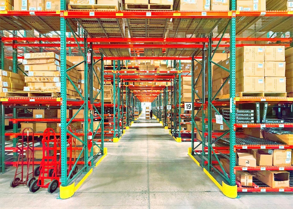 Inventory storage and picking aisles in a distribution warehouse